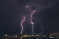Lightning storm over countryside city at night in Thailand