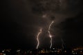 Lightning storm over countryside city at night in Thailand