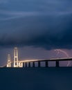 Lightning strike behind the Great Belt bridge Royalty Free Stock Photo