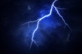 A lightning strike on a cloudy dramatic stormy sky. Royalty Free Stock Photo
