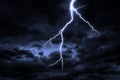 A lightning strike on a cloudy dramatic stormy sky. Royalty Free Stock Photo