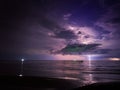 Lightning strike in the darkness, storm on the sea Royalty Free Stock Photo