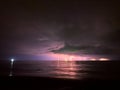 Lightning strike in the darkness, storm on the sea Royalty Free Stock Photo