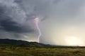 Lightning strike hitting a mountain in a thunderstorm Royalty Free Stock Photo