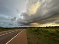 Lightning strike on the horizon during an electrical storm on the grassland Royalty Free Stock Photo