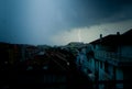 Lightning strike over dark blue sky in night city Royalty Free Stock Photo