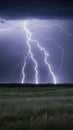 Lightning strike on prairie horizon during electrifying storm scene Royalty Free Stock Photo