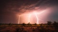 a lightning strike is seen over a desert landscape in this image Royalty Free Stock Photo