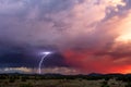 Lightning strike from a storm at sunset Royalty Free Stock Photo