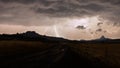 Lightning strikes in the distance on a rain wet road in Southern Utah Royalty Free Stock Photo