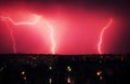 Lightning strikes down over the city at night. Beautiful shot. L Royalty Free Stock Photo