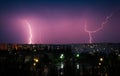 Lightning strikes down over the city at night. Beautiful shot. L Royalty Free Stock Photo
