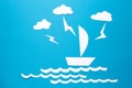 Lightning strikes in paper ship origami floats on waves. Clouds and lightning over white paper ship with sail on blue background Royalty Free Stock Photo