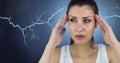 Lightning strikes and stressed woman with headache holding head