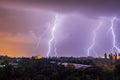 Lightning strikes during thunderstorm over the city Royalty Free Stock Photo