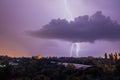 Lightning strikes during thunderstorm over the city Royalty Free Stock Photo