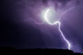 Lightnings over a forest during night thunderstorm Royalty Free Stock Photo