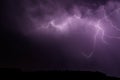 Lightnings over the forest during night thunderstorm Royalty Free Stock Photo