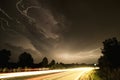 Lightnings over the road Royalty Free Stock Photo