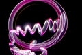 Lightpainting effect with purple circle and waves, created with bulb exposure