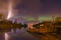 Lights above the lake,man with a dog-Aurora borealis Royalty Free Stock Photo