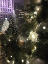 Lights and Ball Ornaments on a Christmas Tree with Rain Drops after Rain in the Evening. Royalty Free Stock Photo