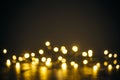 Lights in bokeh background. Yellow and gold lights in bokeh on a black dark background. Holiday, background decoration concept Royalty Free Stock Photo