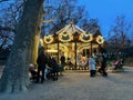 Lights on the carousel in the early evening in the Parc Monceau, Paris, France