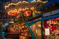 Christmas market spirit during snow night. Royalty Free Stock Photo