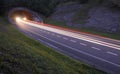 Lights of the cars on the road to the tunnel. Royalty Free Stock Photo