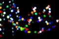 Lights from Christmas garlands defocused in beautiful bokeh.