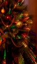 Lights on Christmas tree in focus with two second exposure while zooming to create abstract light streaks.Colorfull Royalty Free Stock Photo