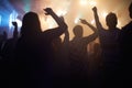 Lights, energy and people dancing at music festival from back, night and silhouette at live concert event. Dance, fun Royalty Free Stock Photo