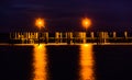 Lights on a fishing pier at night, in Havre de Grace, Maryland. Royalty Free Stock Photo