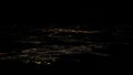 Lights of roads Amsterdam city top view from airplane window at night Royalty Free Stock Photo