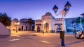 Lights illuminate a building at dusk in Mdiq, Morocco