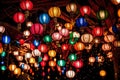 lights and lanterns on the ceiling of a hall