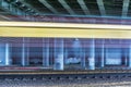 Lights of the moving fast train under the bridge Royalty Free Stock Photo