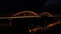 Lights of the night bridge over the river. Summer night