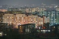 The lights of the night city. View of the busy city traffic and the light from the headlights of cars at night. The lights are on