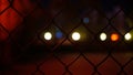 Lights outside the chain link fence