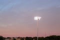 Lights over an American football field during evening sunset Royalty Free Stock Photo