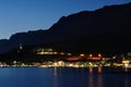 Lights of Podgora at night with Biokovo mountain