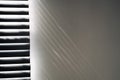 Lights shadows. Abstract light, black shadow overlay from window on white texture wall. Sunlight architecture background Royalty Free Stock Photo