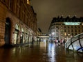 Rain-soaked plaza of Gare Saint-Lazare at night, Paris, France Royalty Free Stock Photo