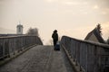 Lights shining through mist in the night over the bridge. Royalty Free Stock Photo