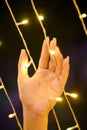 Lights in woman`s hands