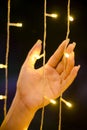 Lights in woman`s hands