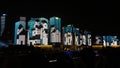 Lightshow projected on buildings at night