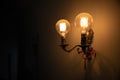 Ights on wall orange soft glow from Edison bulbs Royalty Free Stock Photo